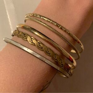 5 Gold tone bracelets